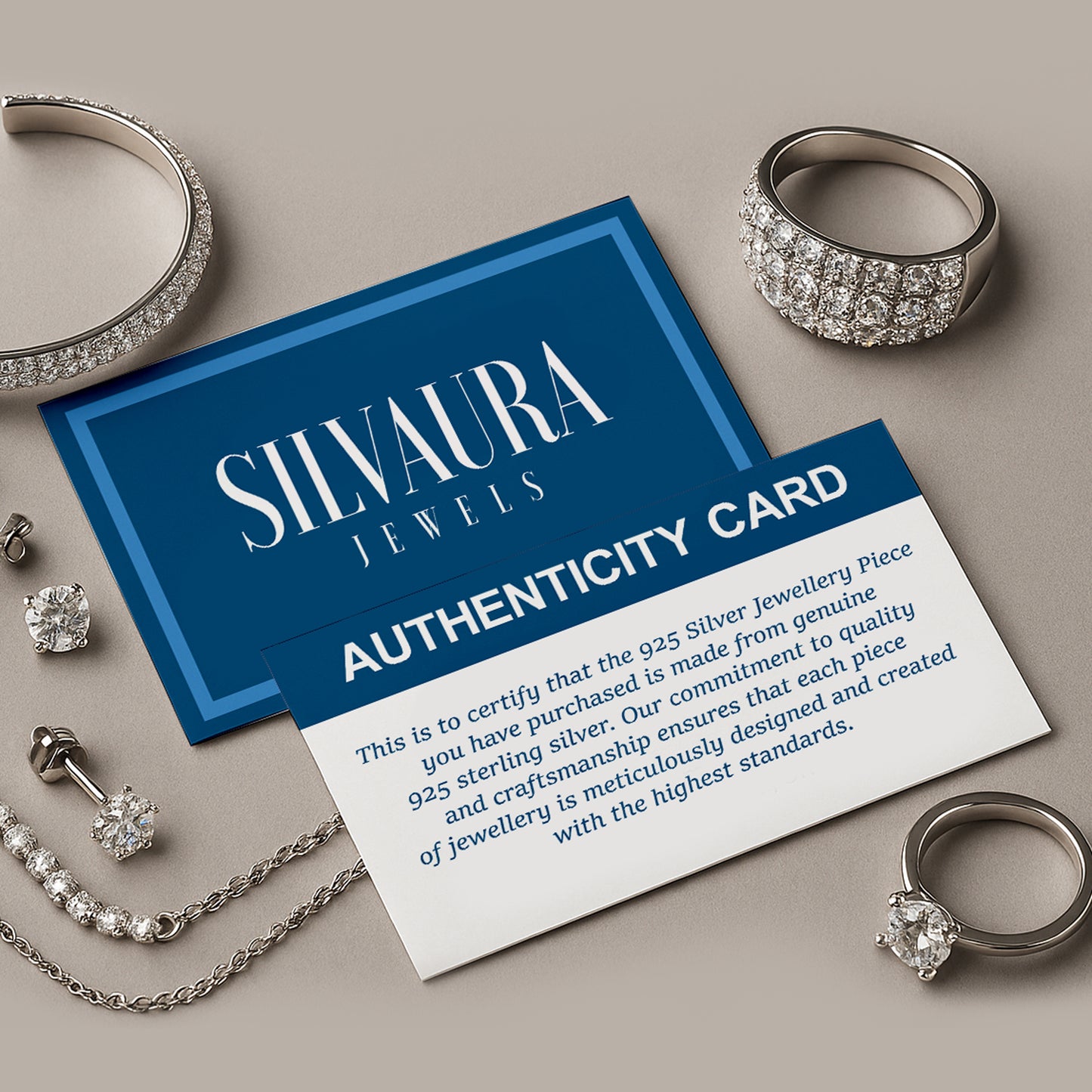 SILVAURA JEWELS authenticity card with assorted sterling jewelry and sterling silver lightning bolt hoop earrings